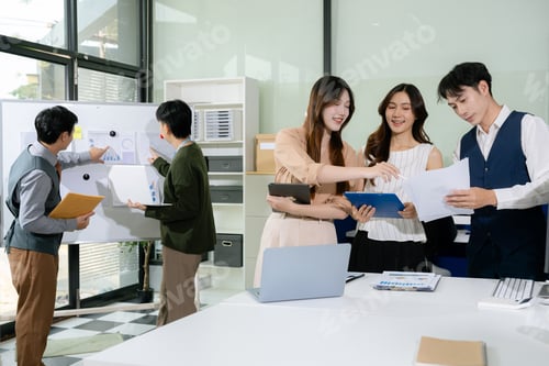 Preview: Businessmen write project ideas and use laptops to edit papers for brainstorming sessions with partn