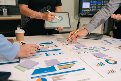 Preview: Business Team Working on a Project in the Office or Reviewing and Discussing a Business Project.