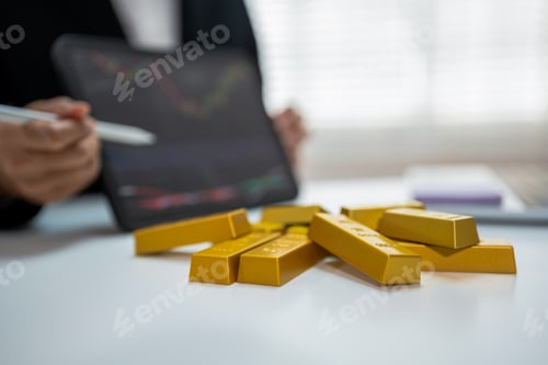 Preview: Gold investment concept with businesswoman analyzing market data on tablet, stack of gold bars.