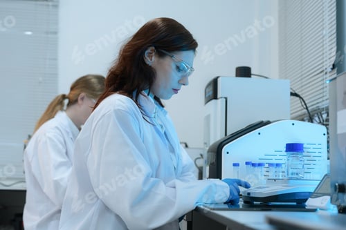 Preview: Scientist biotechnologist testing new chemical substances in a laboratory.