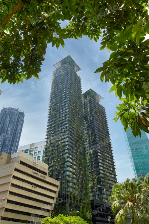 Preview: Twin tower building overgrown with vertical growing garden. Sustainable architecture in Kuala Lumpur