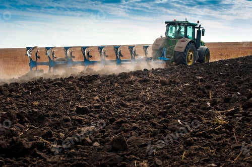 Preview: Baykivtsi, Ternopil region, Ukraine - October 18, 2019: farm tractor pulls 8-section plow, preparing