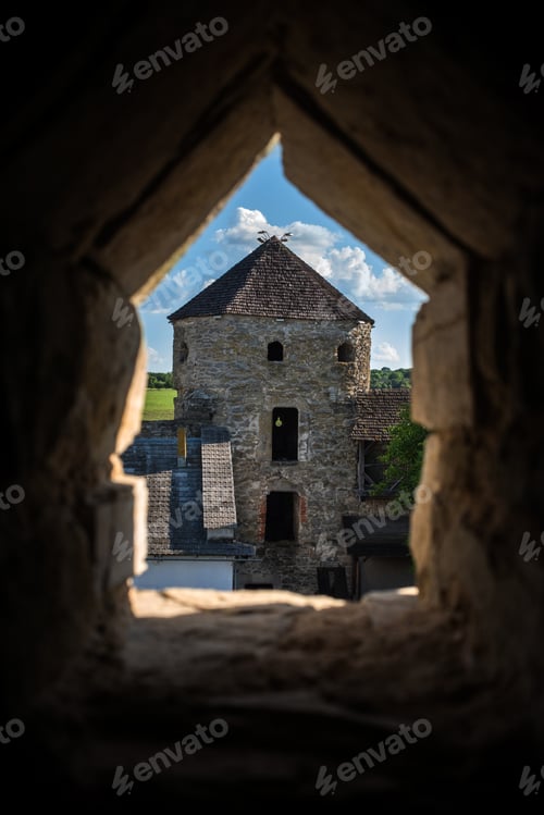 Preview: The Pope's Tower through the loophole of the defensive wall of the Kamianets-Podilskyi Fortress