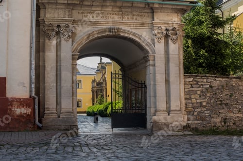 Preview: old entrance triumphal arch gate with sculptures on the church grounds of the Holy Apostles Peter an