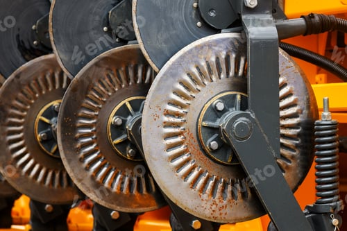 Preview: Agricultural tractor harrowing equipment, closeup