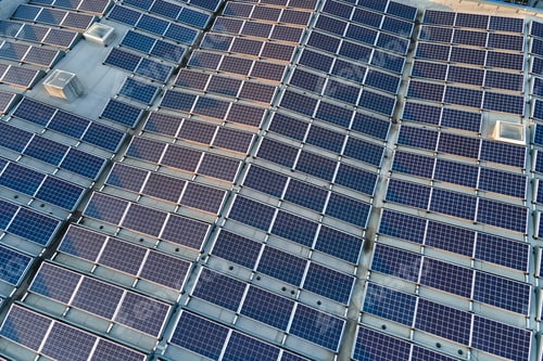 Preview: Aerial view of solar power plant with blue photovoltaic panels