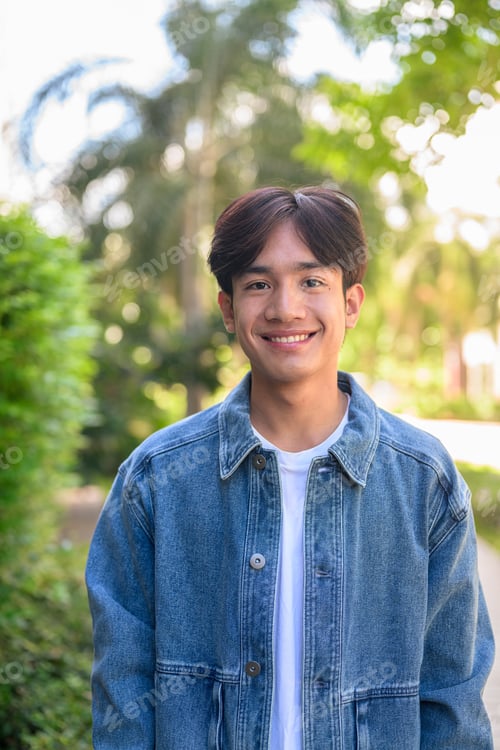 Preview: Happy young Asian man outdoor portrait