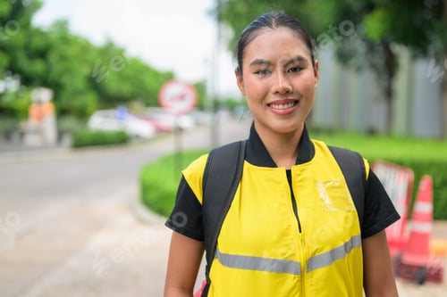 Preview: Horizontal Portrait of Smiling Thai Female Delivery Courier on City Street
