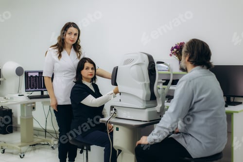 Preview: Ophthalmologists examining patient's vision in clinic