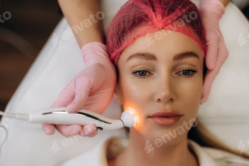Preview: Woman receiving rf lifting facial skin treatment