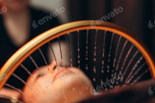 Preview: Woman receiving stimulating head water therapy at spa