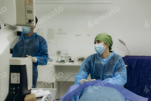 Preview: Surgeon performing medical procedure in operating room
