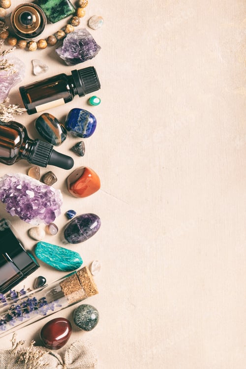 Preview: Assorted Crystals, Essential Oils, and Dried Herbs on Beige Background