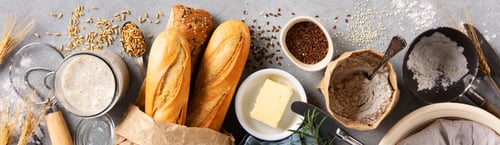 Preview: Baking Ingredients and Fresh Baguettes on Light Stone Surface