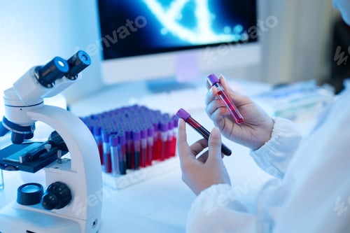 Preview: Laboratory Scientist Holding Blood Sample Test Tubes with Microscope and DNA Screen in Medical Lab