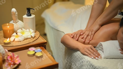 Preview: Calm young woman receiving a relaxing shoulder massage at a luxury spa