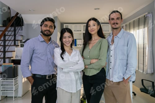 Preview: Group of multiethnic young business friends gathered in a modern office conference room and worked a