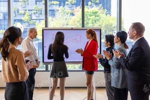 Preview: Businesswoman Presenting Strategy to Corporate Team