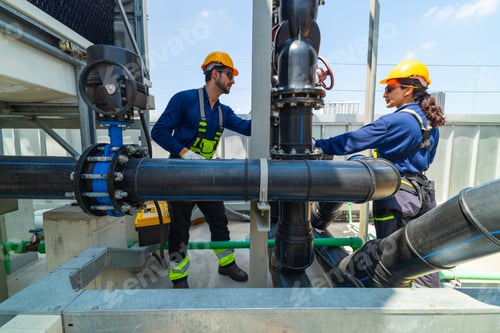 Preview: Industrial Technicians Inspecting Large Pipeline Valve