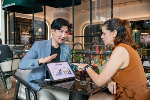 Preview: Business meeting in a cafe discussing user growth data