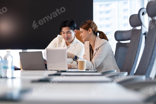 Preview: Business team collaborating in modern office meeting