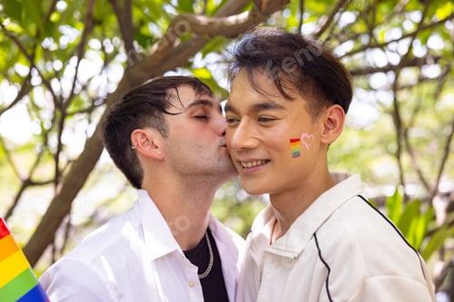 Preview: Couple sharing a kiss at Pride celebration