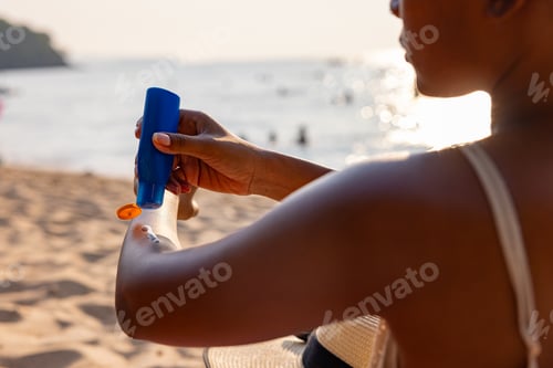 Preview: Applying Sunscreen on Arm at Sunny Beach