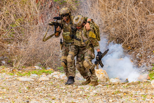 Preview: Soldier assisting injured teammate during combat