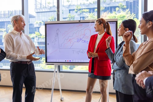 Preview: Businesswoman Presenting Strategy to Corporate Team