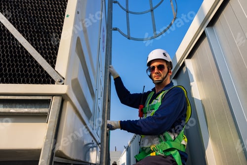 Preview: Industrial Technicians Climbing Ladder at Facility