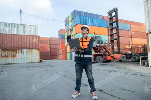 Preview: Logistics manager using laptop at container yard