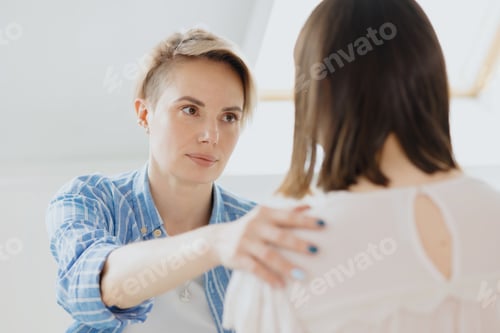 Preview: a young and beautiful European woman psychologist or psychiatrist with short blonde hair conducts th