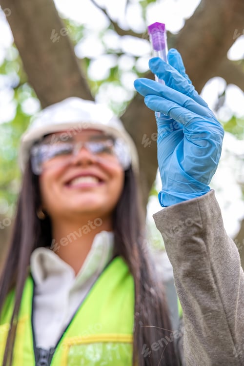 Preview: Latin woman environmental engineer testing water sample