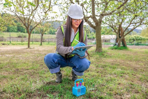 Preview: Latina female environmental engineer testing pollution samples