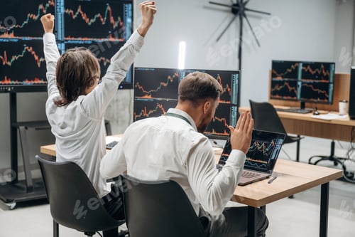 Preview: Hands are up, celebrating success. Two male exchange workers are in the office together