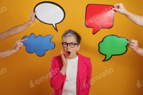 Preview: Woman in pink blazer expresses surprise while surrounded by colorful speech bubbles on a vibrant yel