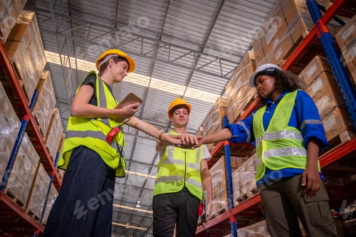 Preview: Warehouse workers wearing safety discussing inspection inventory detail storage facility shelves pac