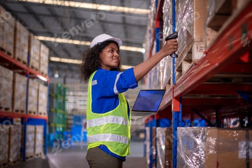 Preview: Warehouse workers wearing safety discussing inspection inventory detail storage facility shelves pac