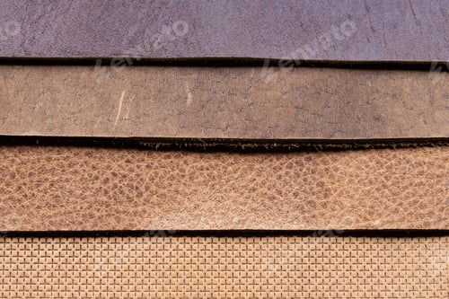 Preview: Layered Leather Sheets in Brown Tan and Purple Tones Showing Grain Texture Detail