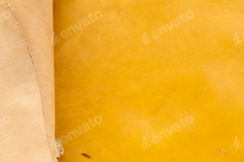 Preview: Layers of natural beige and bright yellow leather overlapping with raw edge detail