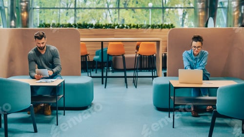 Preview: Two colleagues keeping social distance in modern office, workplace safety