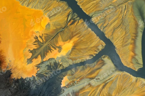 Preview: Surreal colorful natural pattern of mining waste waters in decanting lake aerial view