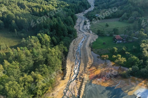 Preview: Aerial view of flowing toxic gold mining residual metal-rich water contaminates ecosystems. Rosia Mo