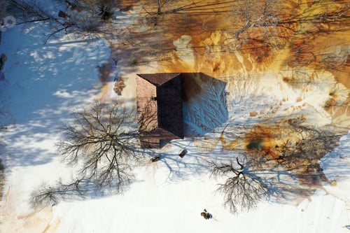 Preview: Aerial view choked sinking village house by acid mine drainage toxic waters