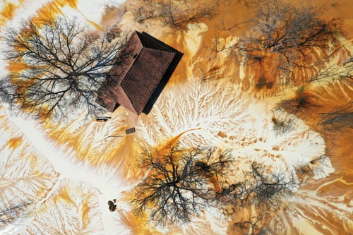 Preview: Aerial view choked sinking village house by acid mine drainage toxic waters