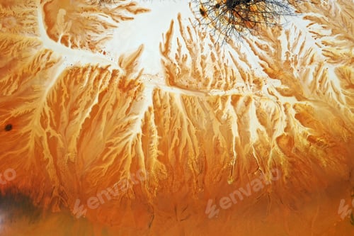 Preview: Aerial abstract surreal natural patterns above. Colorful chemical mining leach residues in decanting