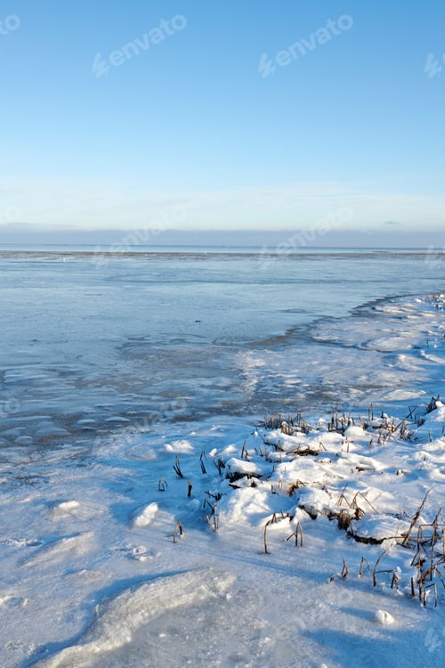 Preview: Landscape, blue sky and lake with snow in nature for climate change, winter season