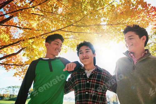 Preview: Outdoor, teens and boys with smile, hug and laughing at funny story, bonding or together on weekend