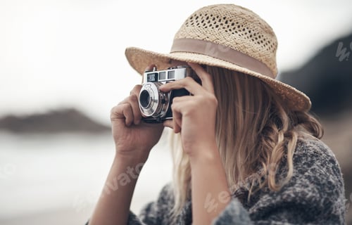 Preview: Camera, memories and photography with woman on beach for holiday, tourism or vacation in morning