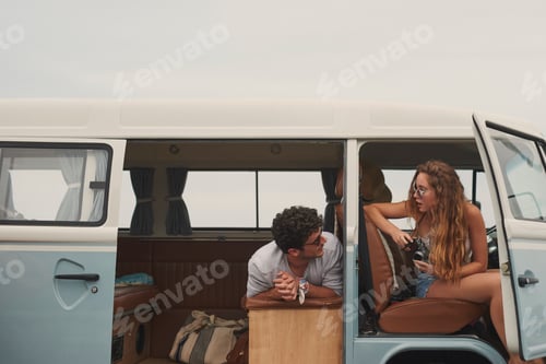 Preview: Happy, travel and couple in camper van for road trip, weekend and bonding on vacation together